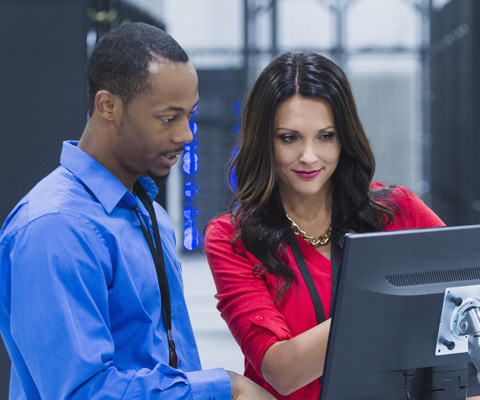 man and woman at monitor